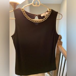 Black sleeveless Calvin Klein with gold chain embellishment. Keyhole in back